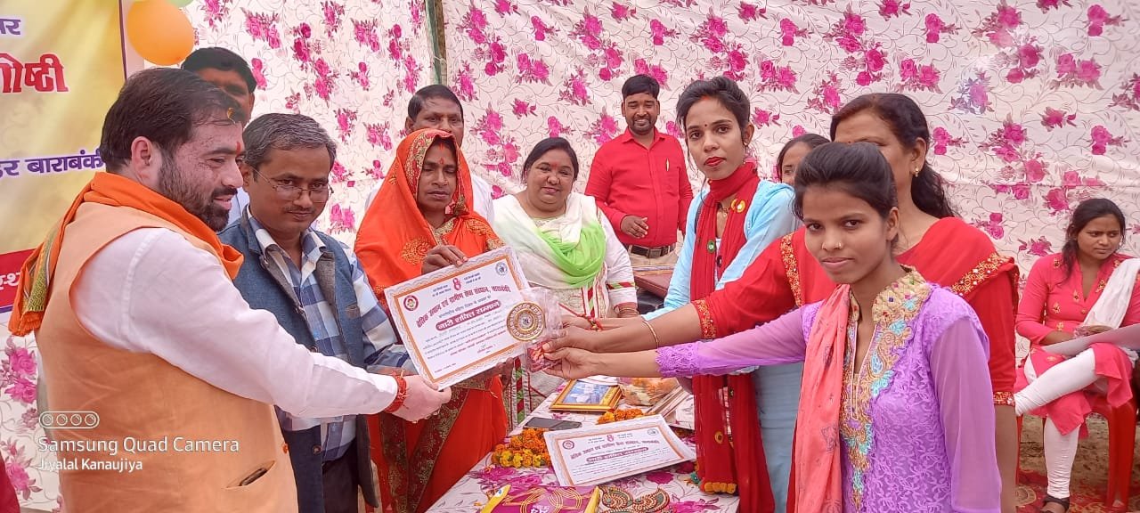 Certificate of recognition being presented to a woman participant